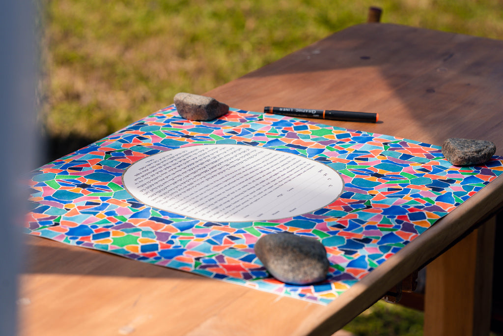 Ketubah signing in an outdoor Jewish wedding ceremony 